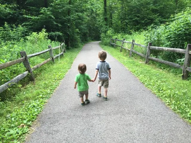 two boys walking down a path at Blendon Woods Metro Park