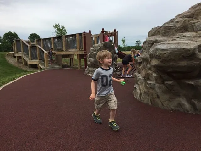 boy running on playground area at Rocky Fork Metro Park.