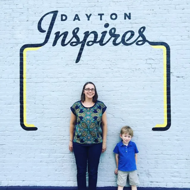 Mother and son at the Dayton Inspires sign.