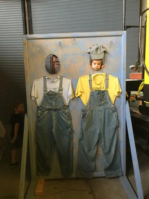 boys posing for a pictures in Engineer outfits at the Railroad Museum in Bellevue Ohio