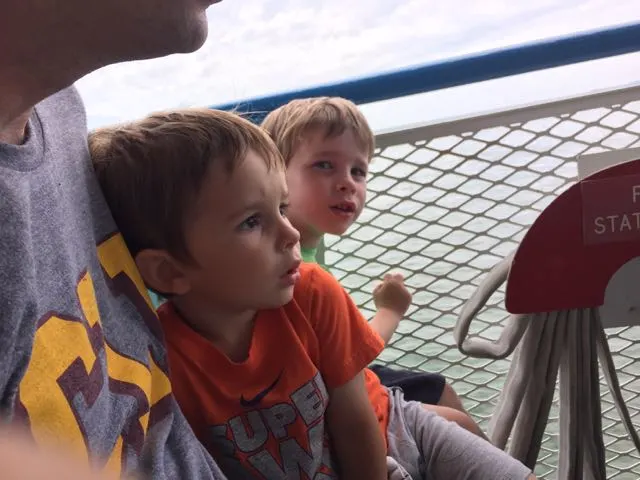 Two boys riding the Miller Ferry.
