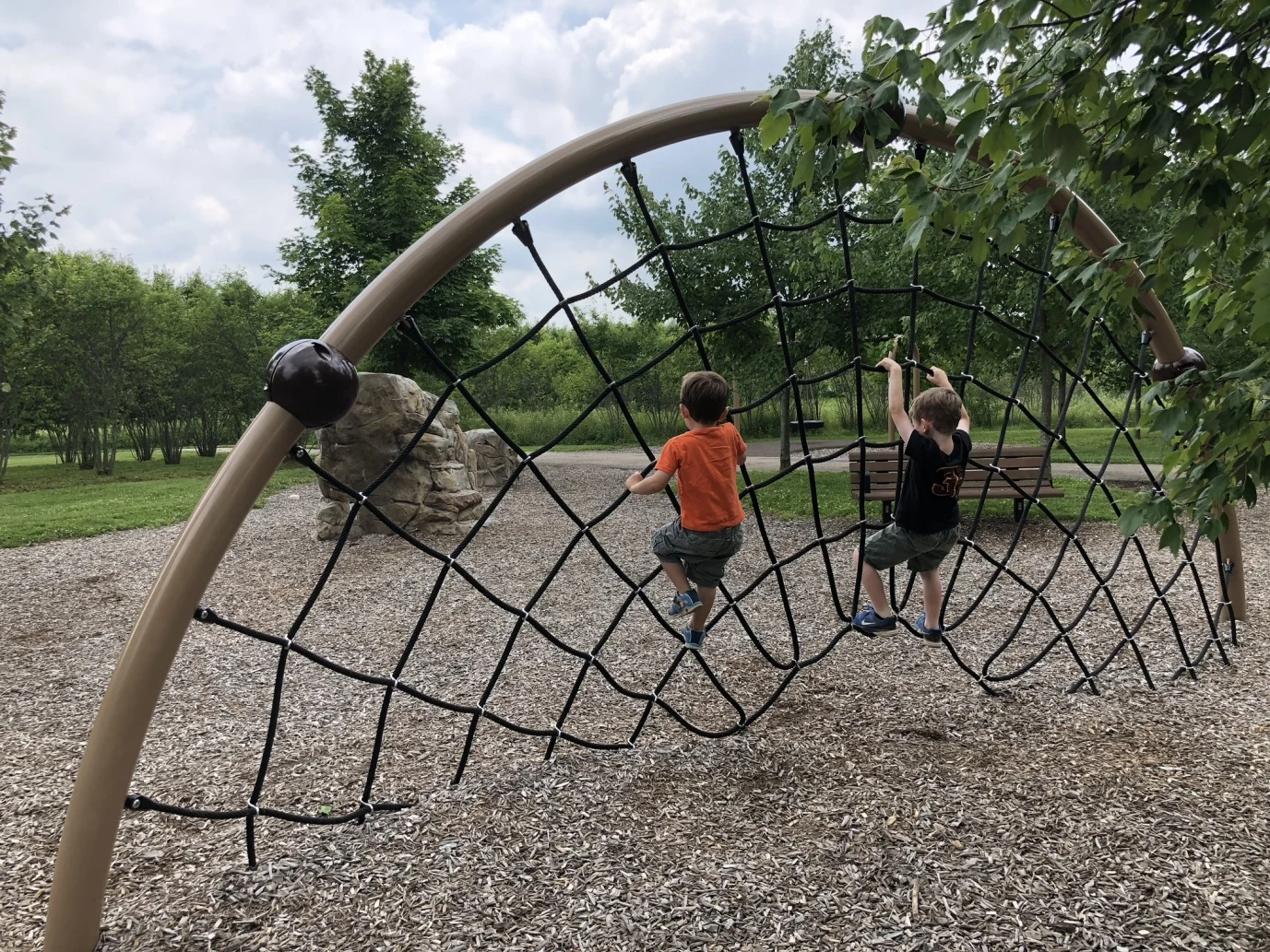 boys rope climbing at walnut woods metro park playground