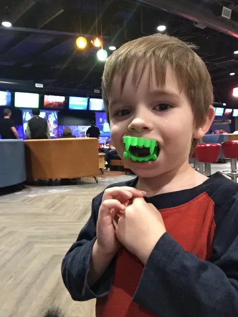 kid at arcade at Ten Pin Alley