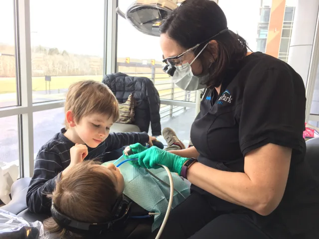 Kid getting teeth cleaned at River Park Dental