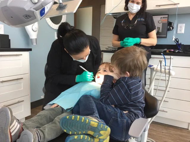 Dentist checking teeth at River Park Dental