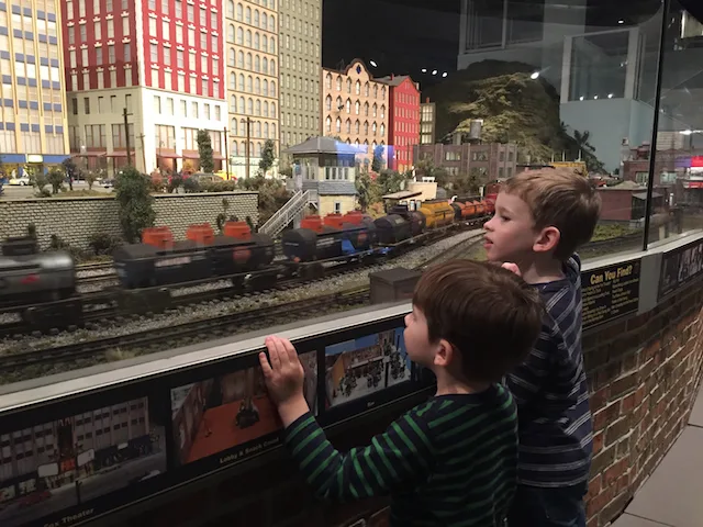 kids watching a model train