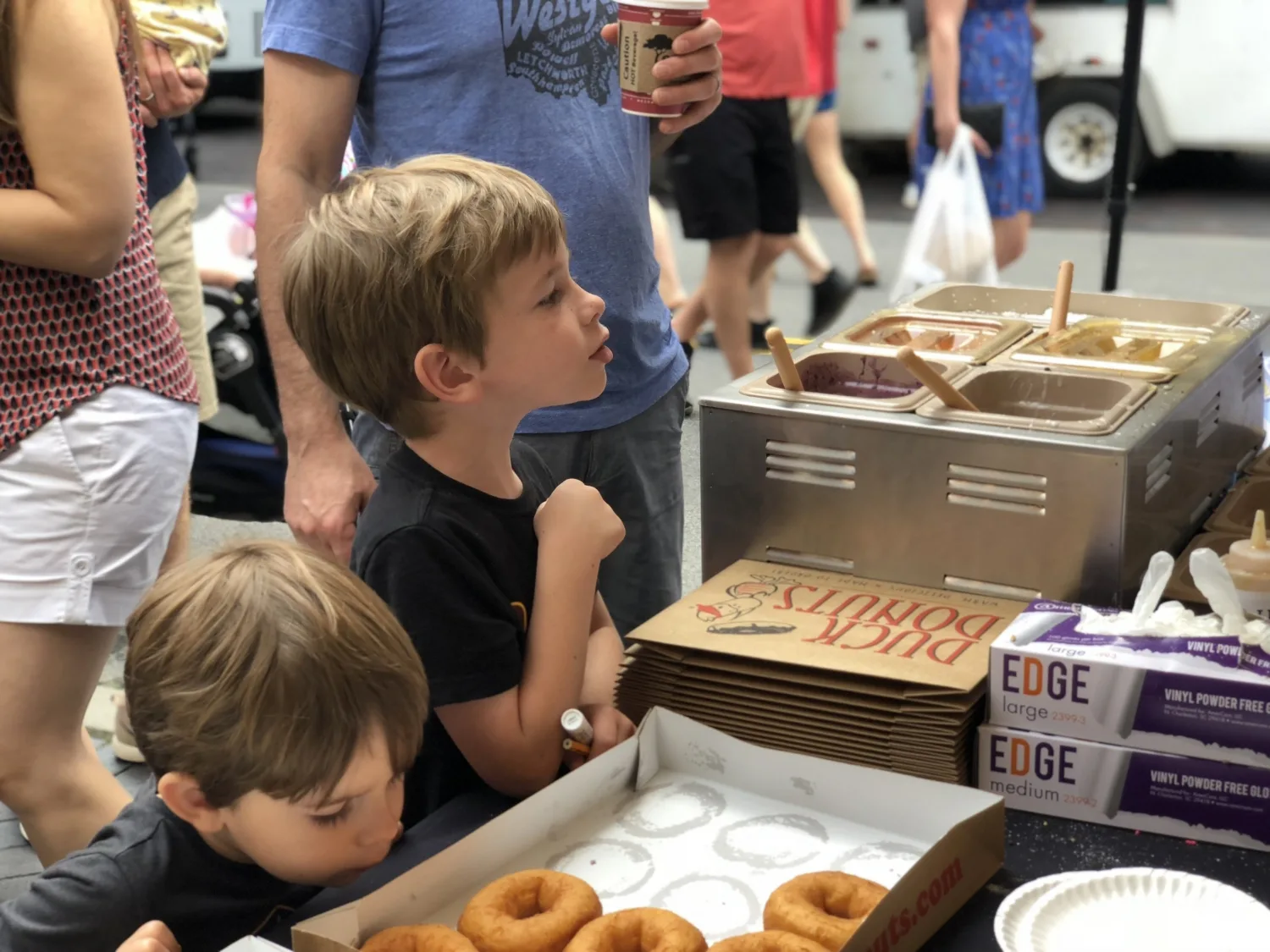 kids ordering donuts at the dublin market