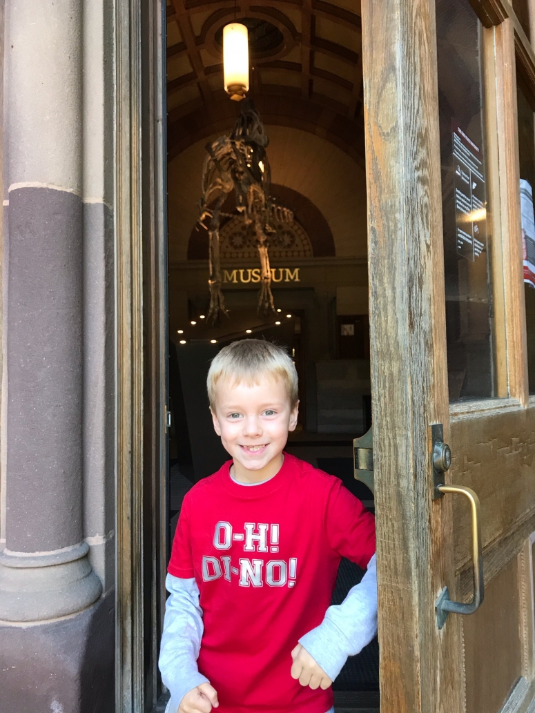 kid standing in front of Orton Geological Museum, Ohio State University Campus