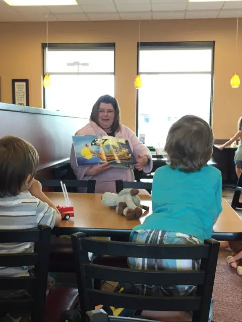 woman reading a story at chick fil a on sawmill