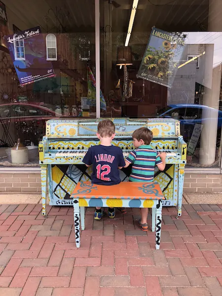 kids playing piano in downtown Lancaster, Ohio