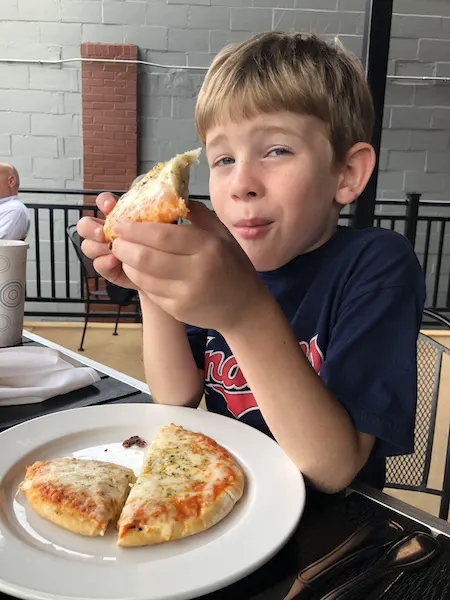 kid eating pizza at Ale House 1890 in Lancaster, Ohio