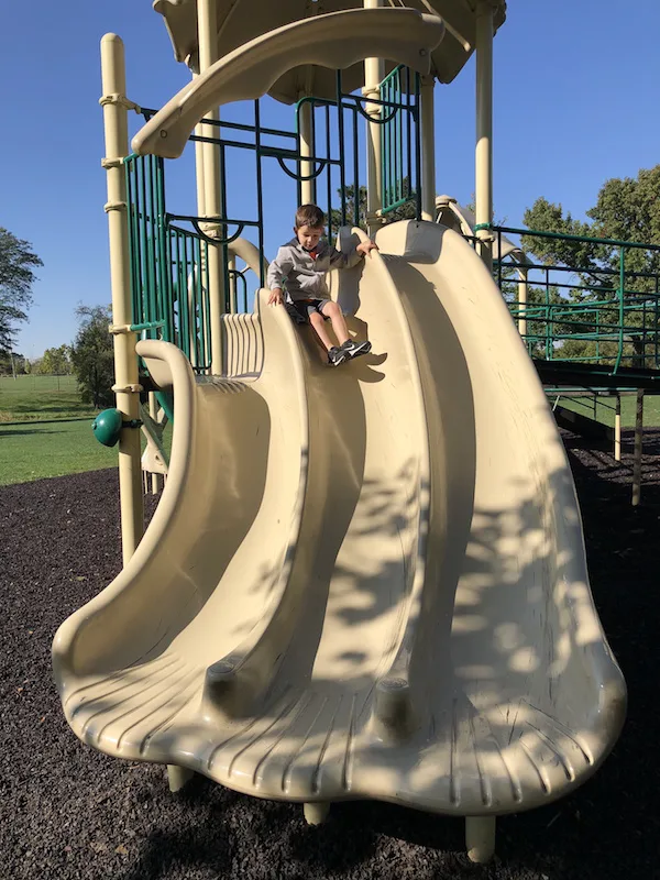 boy on slide at park in dublin ohio