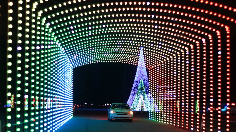 car driving through a lit tunnel at WonderLights Christmas in Ohio