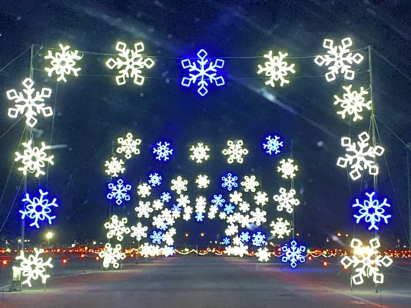 a tunnel of lighted snowflakes at National Trail Raceway - WonderLight's Christmas