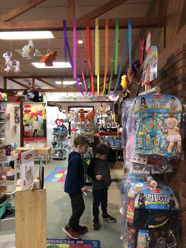 two boys inside The Fun Company in Bellefontaine, Ohio