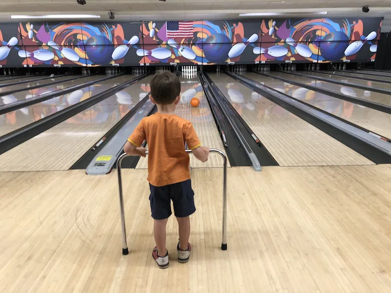 boy bowling at Rollhouse in Columbus, Ohio