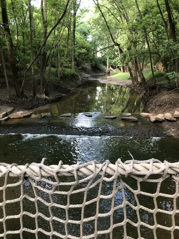 view of the creek from the rope bridge in Scioto Grove Metro Park