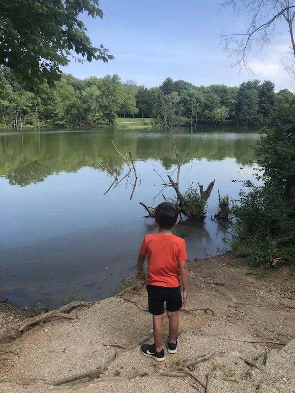 kid looking out over Darby Bend Lake