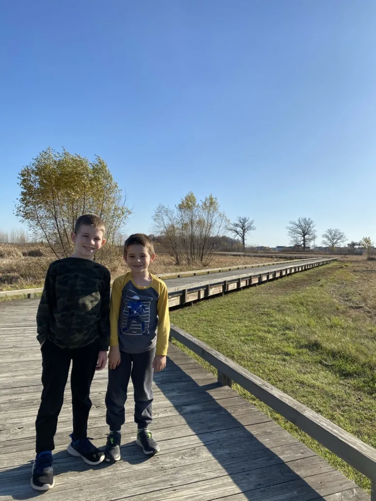 two boys on the boardwalk trail at Glacier Ridge Metro Park