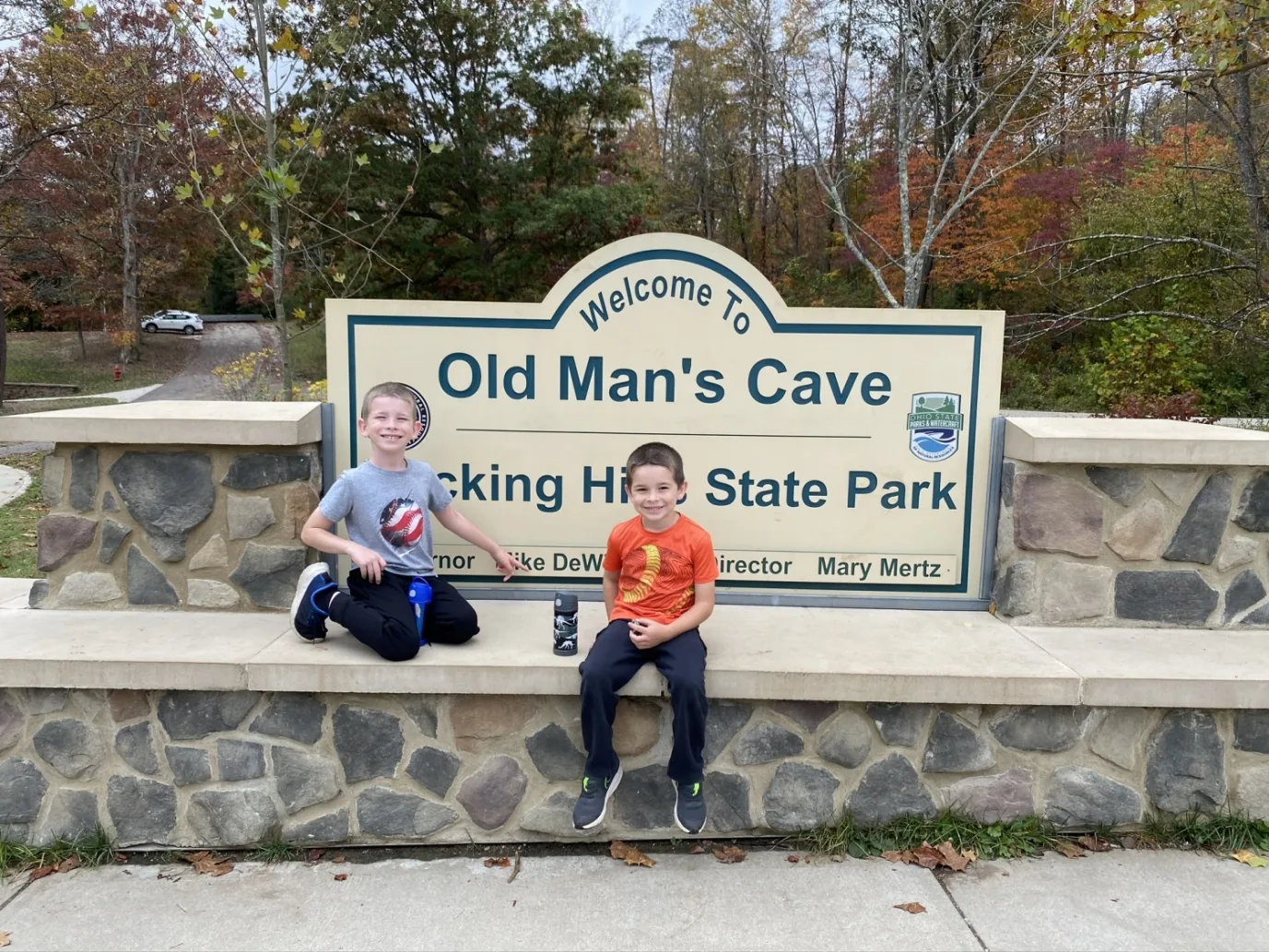 two boys in front of the Old Man's Cave sign at Hocking Hills