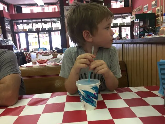 boy with a drink at Big Ed's Soda Grill in Vermilion, Ohio