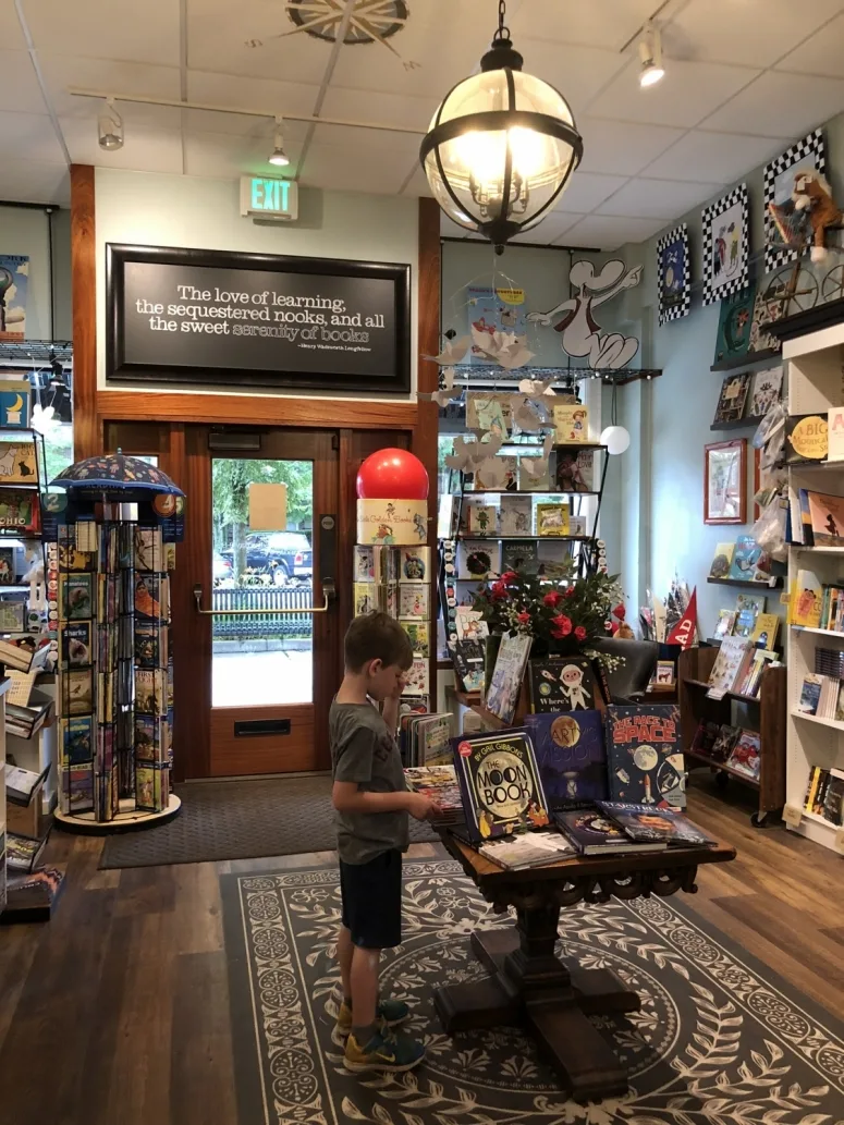 boy standing in the Cover to Cover bookstore in Upper Arlington, Ohio