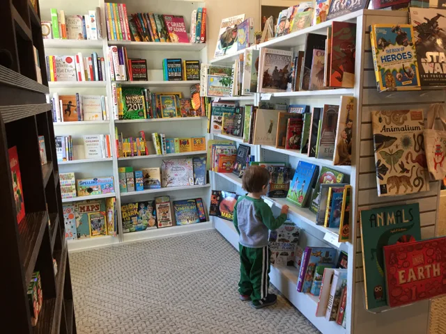 a boy in the children's book area at Gramercy Books