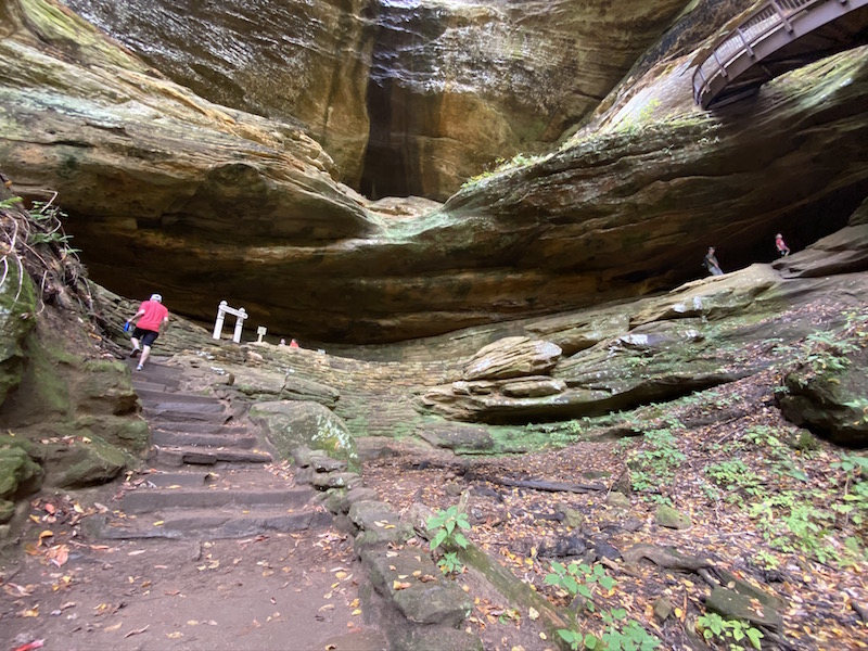 people hiking in the Old Man's Cave recess