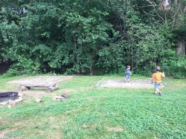 two boys playing at a backpacking site.