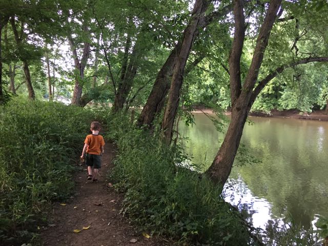 boy walking on the REI River Trail.