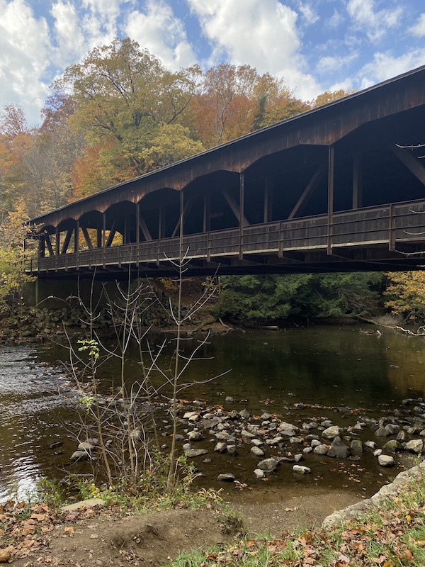 view of the covered bridge across the river at Mohican.