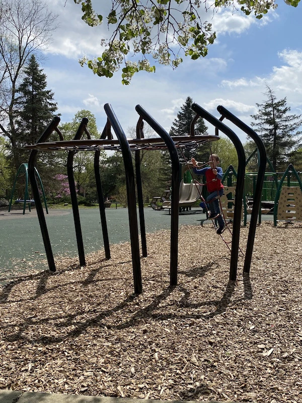 A boy playing on the playground at Franklin Park.