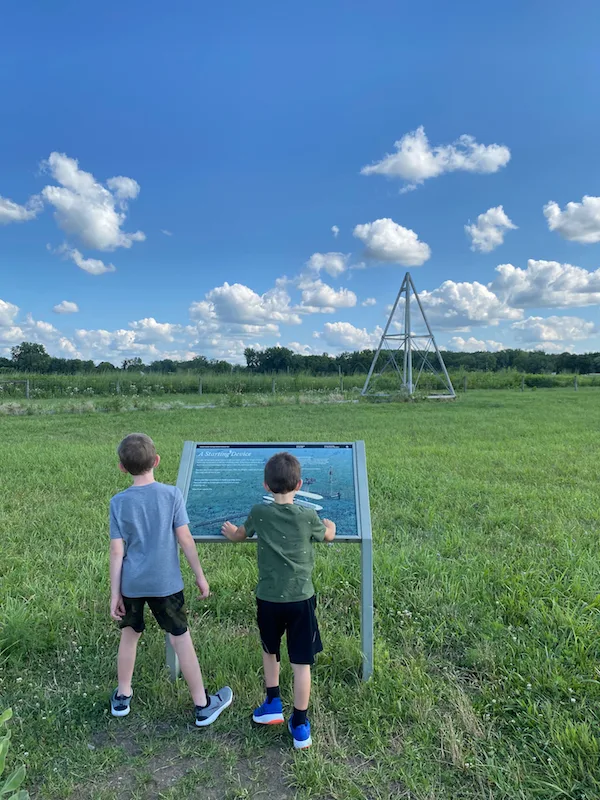 Two boys reading the informational sign at Huffman Prairie Flying Field in Greene County, Ohio.
