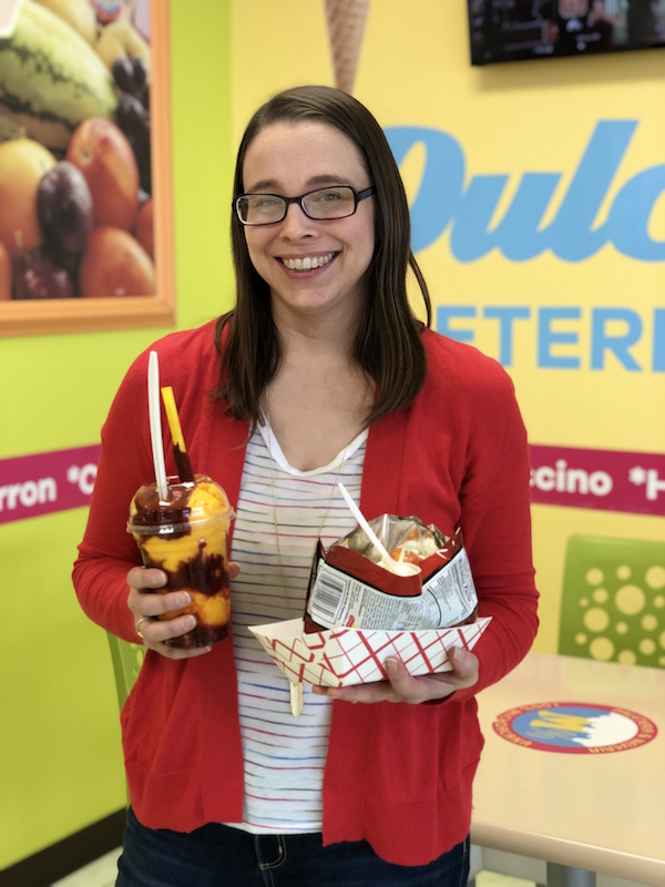 Woman holding dessert at Dulce Vida in Columbus, Ohio.