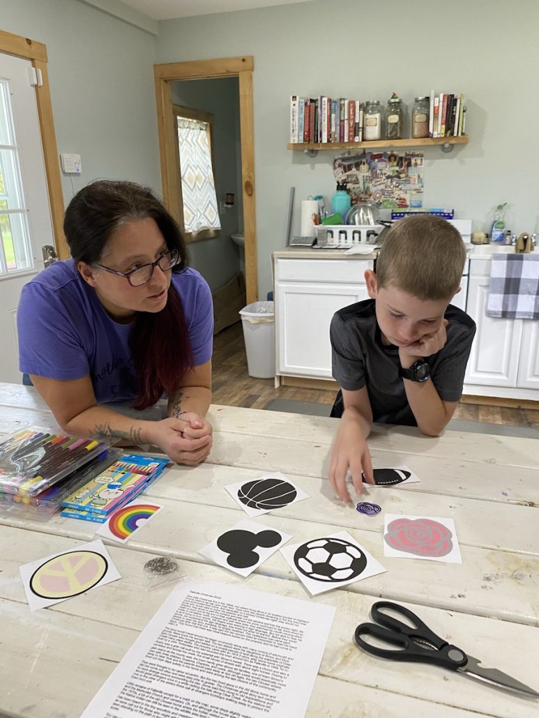 Boy doing a shrinky dink class at Mother Cluckers Farmhouse.