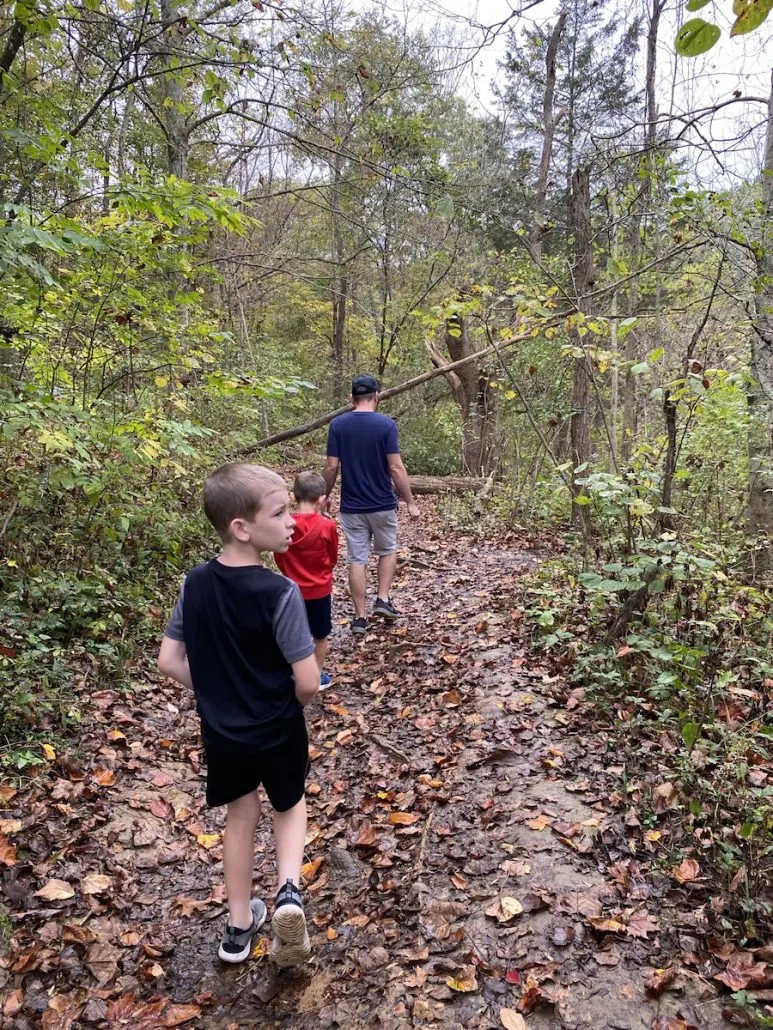 family walking on the hiking trail at Fallsville Wildlife area in New Vienna, Ohio.