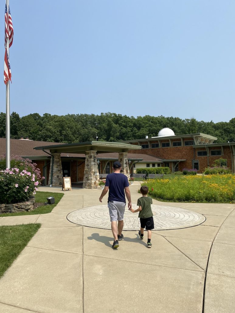 Boy and dad walking to the Environmental Learning Center at Jordan Creek Park.