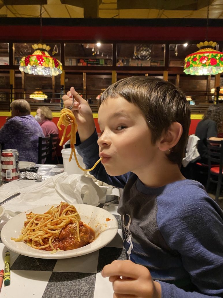 Boy eating at Spaghetti Warehouse, one of the most kid-friendly restaurants in downtown Columbus!