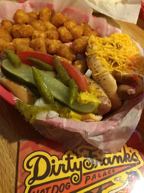 Two hot dogs and tater tots at Dirty Franks Hot Dog Palace, a restaurant  in Columbus, Ohio.