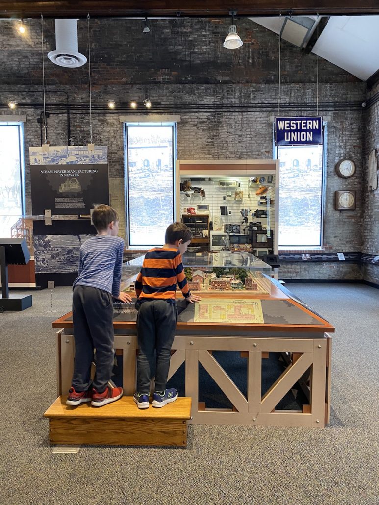 Two boys looking at the historical exhibits at The Works in Newark, Ohio.