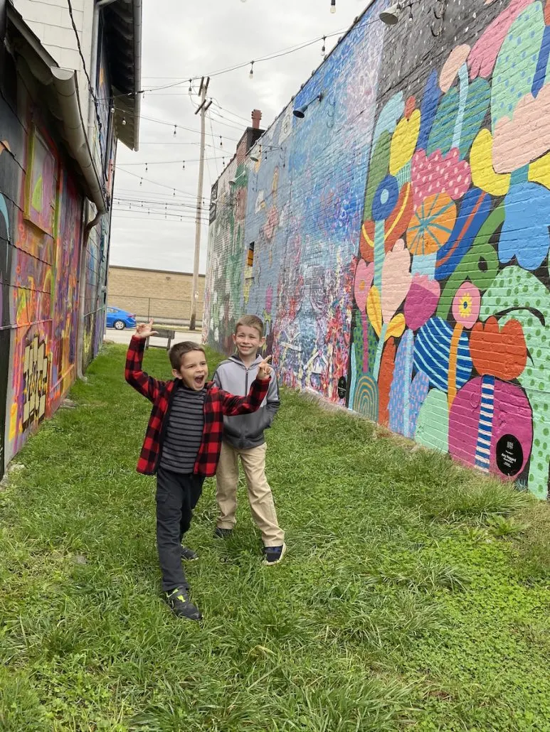 Boys in the Outdoor Gallery at 934 Gallery, an outdoor attraction for families in Columbus, Ohio.
