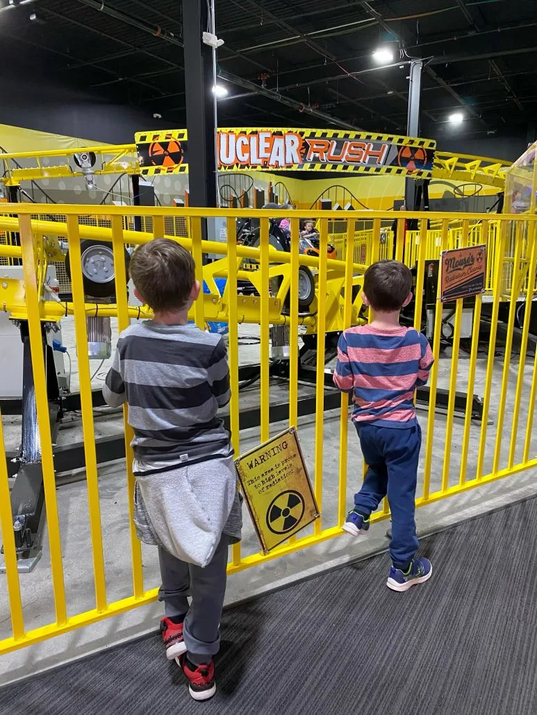 Boys watching the indoor roller coaster at Scene75 in Columbus, Ohio.