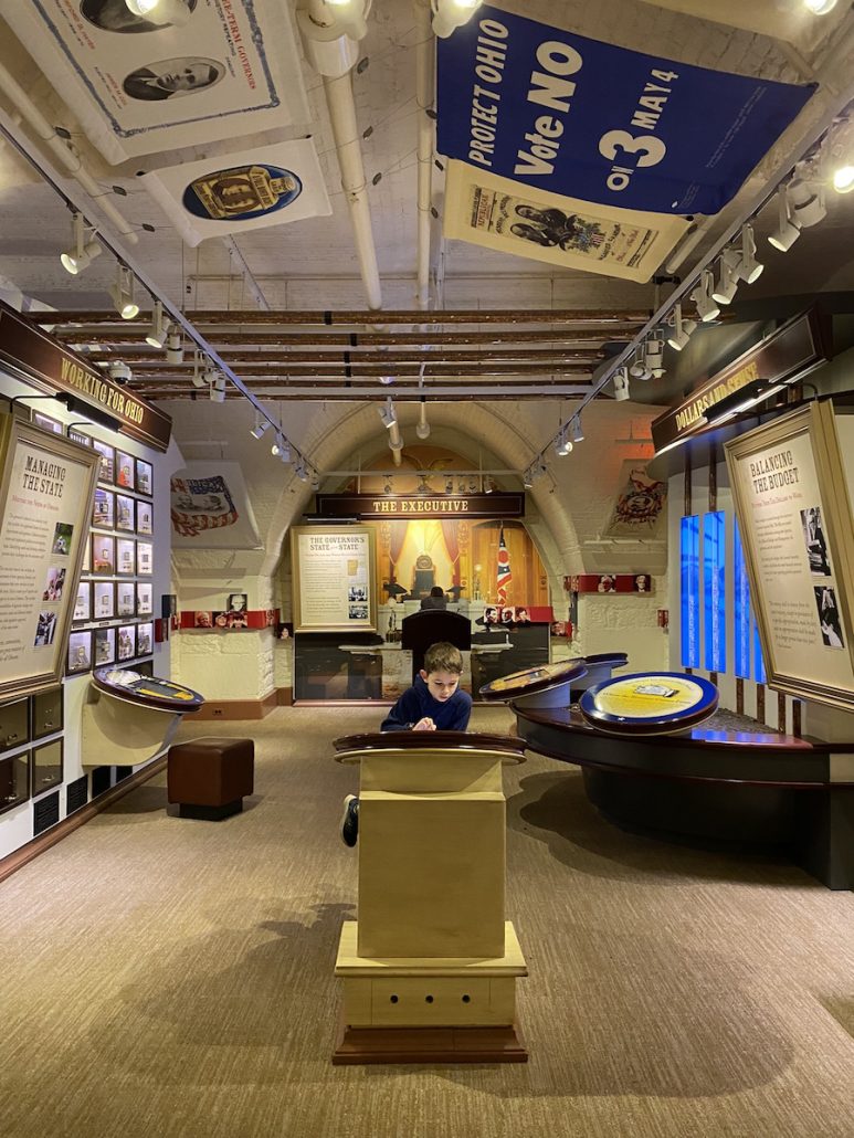 A boy visiting The Statehouse Museum - a free indoor activity in Columbus, Ohio.
