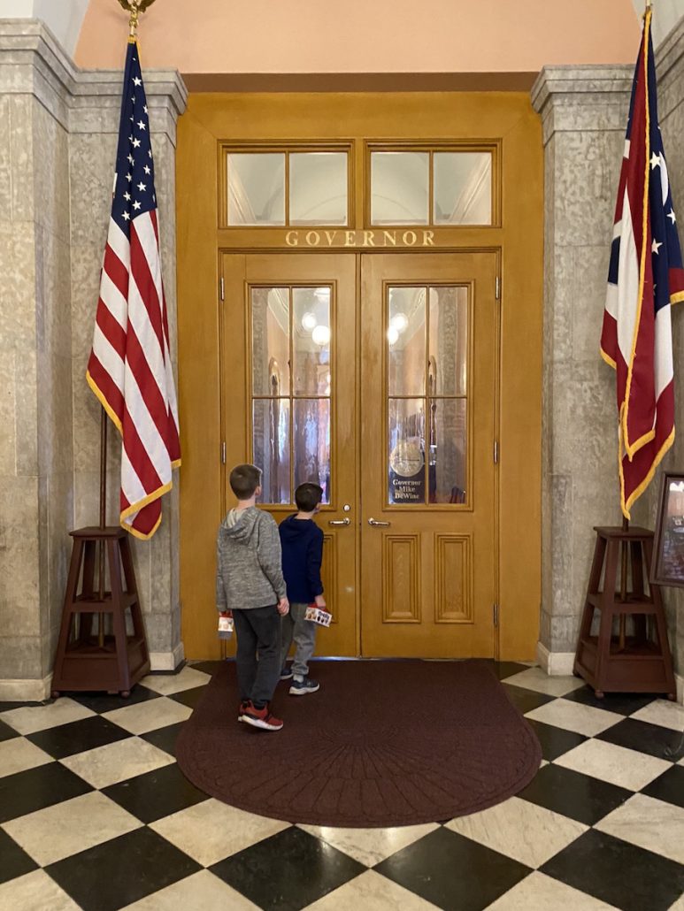 Two boys standing outside the Governor's Office at the Ohio Statehouse in Columbus, Ohio.