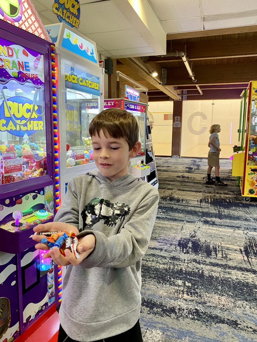 Boy in the arcade at Maumee Bay State Park Lodge.