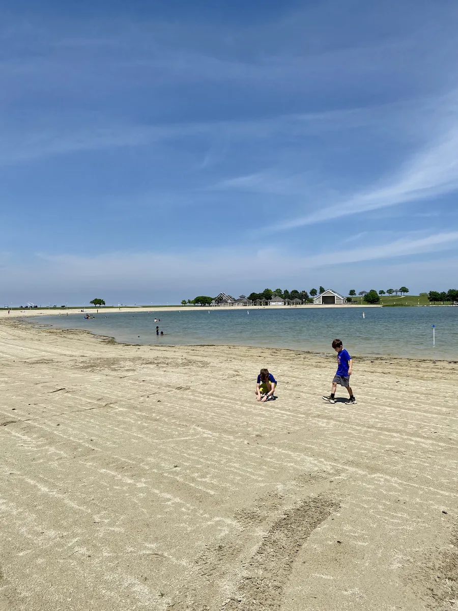 Boys on beach at inland lake at Maumee Bay State Park.