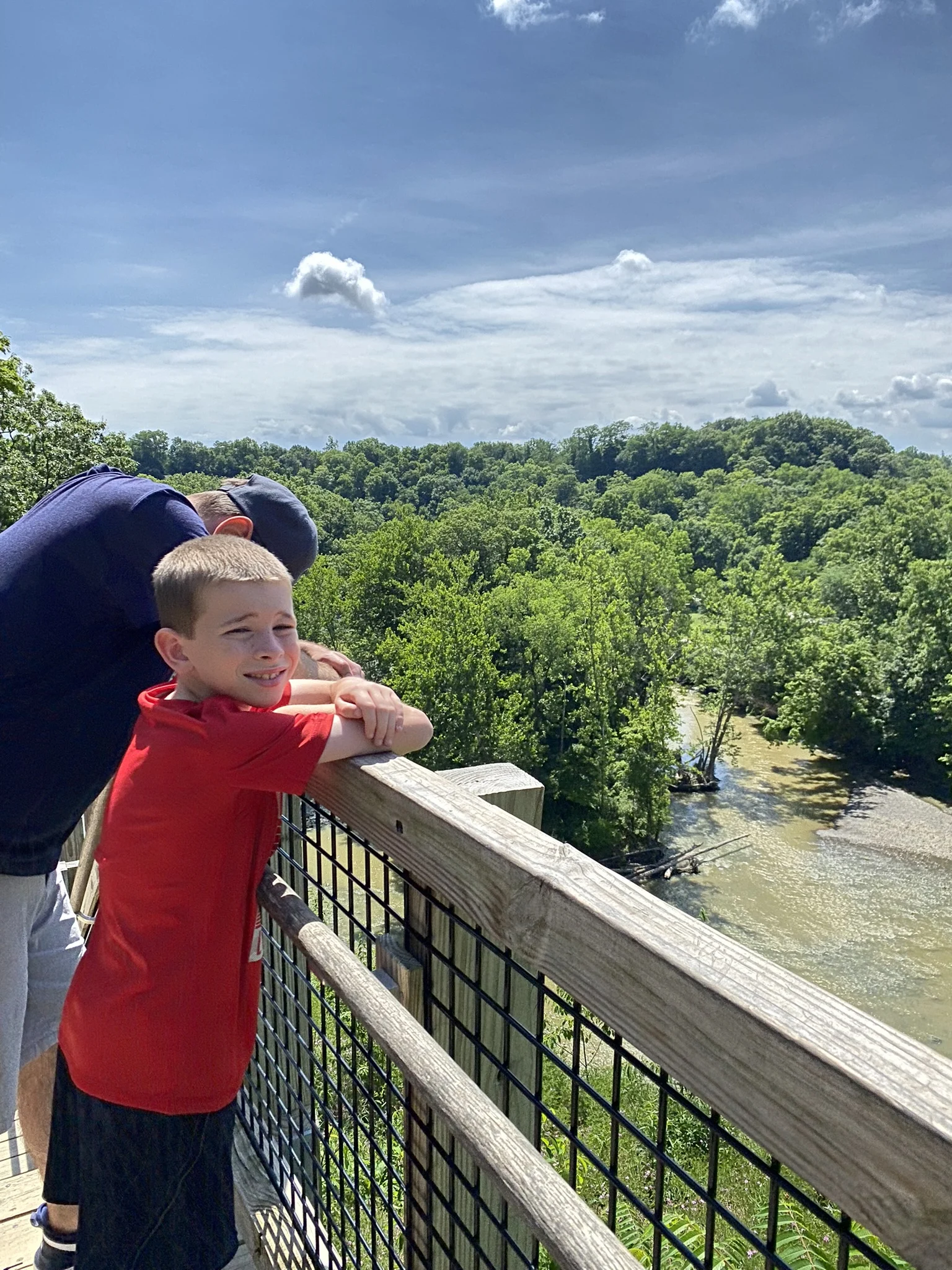 Father and son overlooking the Rocky River on top of the Fort Hill Stairs in the Cleveland Metroparks.