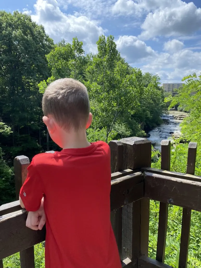 A boy standing at the Scenic Overlook at Berea Falls in Cleveland, Ohio.