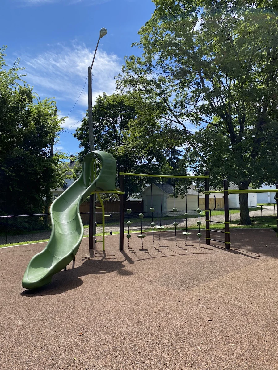Play structure and ropes course in the playground.