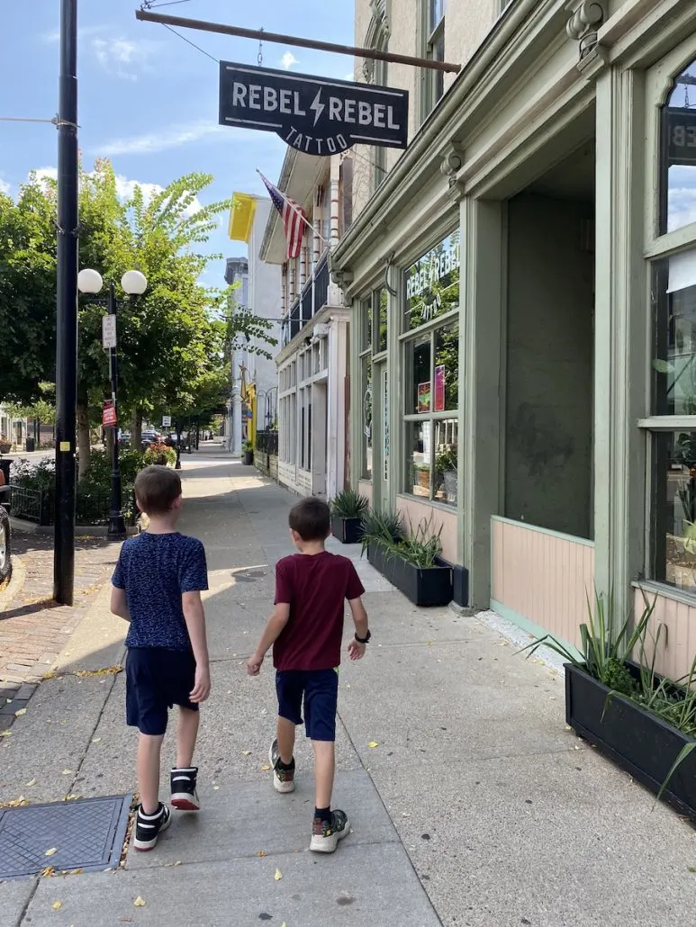 Two boys walking down the sidewalk in the Oregon District in Dayton, Ohio.